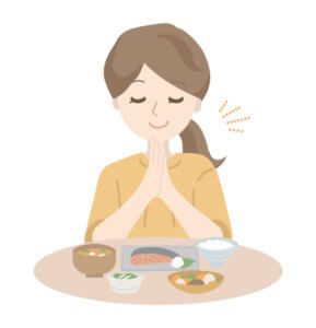 朝食を摂る女性